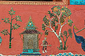 Wat Xieng Thong temple in Luang Prabang, Laos.  La Chapelle Rouge , the Red Chapel. The exterior walls are decorated with colourful mosaics on a pink background with scenes of people daily activities. North wall. 